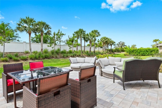 5659 Woodland Sage Dr, Sarasota, FL 34238 - fenced backyard with a patio area, an outdoor hangout area, and outdoor dining area