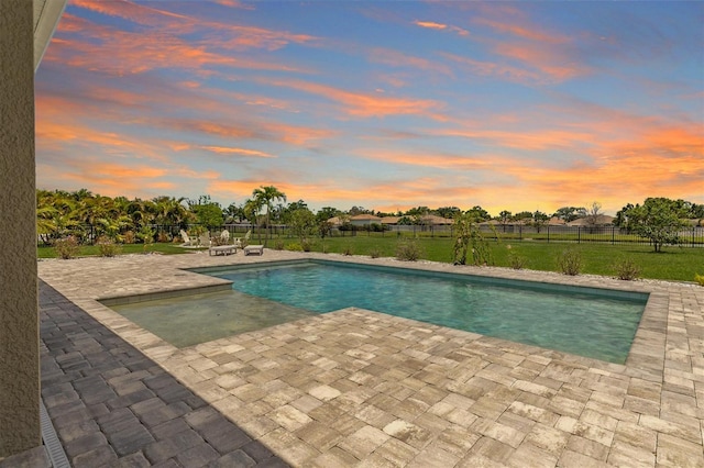 7508 Ripetta St, Sarasota, FL 34240 - pool at dusk featuring a patio area