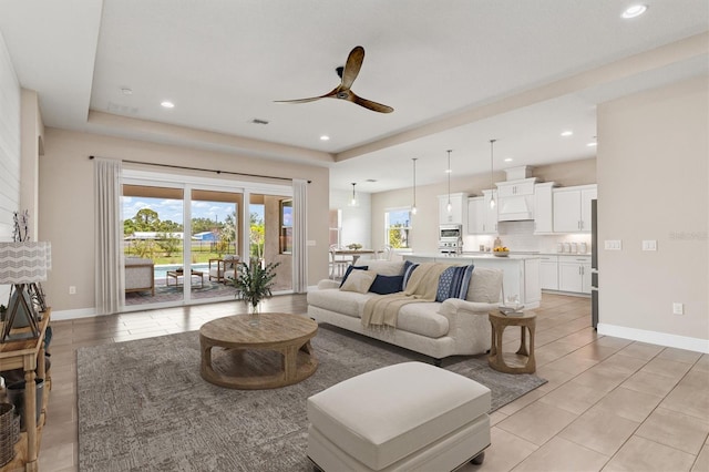 7508 Ripetta St, Sarasota, FL 34240 - living area with ceiling fan, light tile patterned floors, baseboards, and recessed lighting