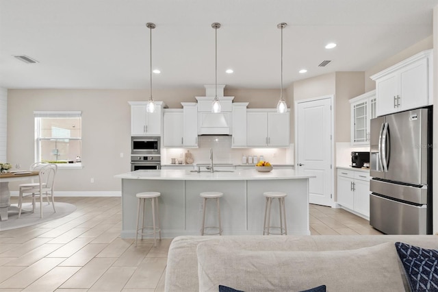 7508 Ripetta St, Sarasota, FL 34240 - kitchen with appliances with stainless steel finishes, backsplash, light countertops, a sink, and white cabinetry
