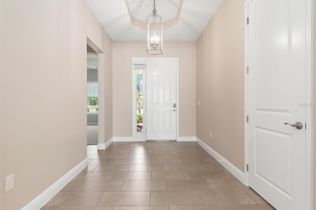 7508 Ripetta St, Sarasota, FL 34240 - foyer entrance featuring baseboards and light tile patterned floors