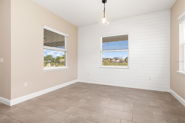 7508 Ripetta St, Sarasota, FL 34240 - empty room with baseboards and wooden walls