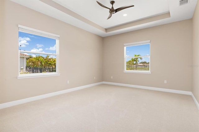 7508 Ripetta St, Sarasota, FL 34240 - unfurnished room with baseboards, a ceiling fan, light carpet, a tray ceiling, and recessed lighting