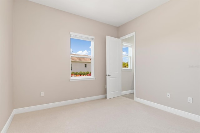 7508 Ripetta St, Sarasota, FL 34240 - carpeted empty room featuring baseboards