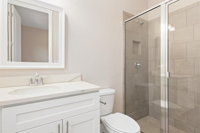 7508 Ripetta St, Sarasota, FL 34240 - full bathroom featuring toilet, vanity, and a stall shower