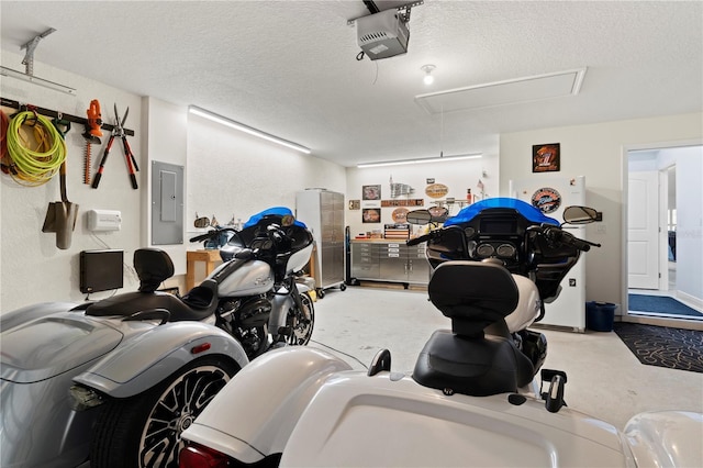 9229 52nd Ave E, Palmetto, FL 34221 - garage with a garage door opener and electric panel