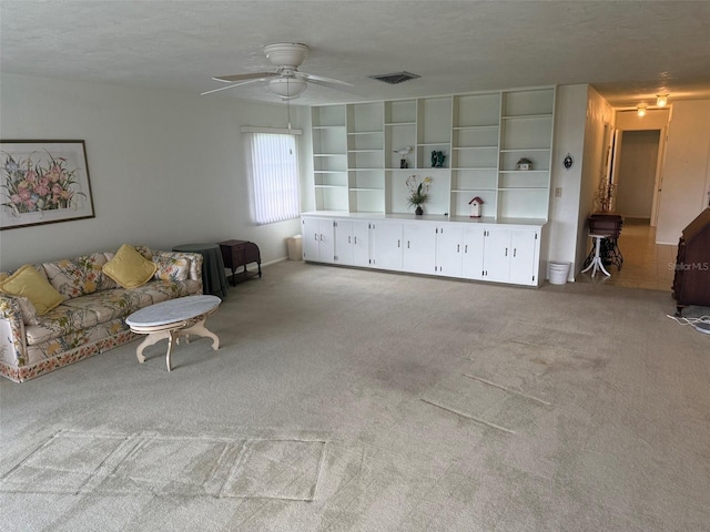 3673 Somerville Dr Unit 1510, Sarasota, FL 34232 - unfurnished living room featuring ceiling fan, carpet flooring, and a textured ceiling