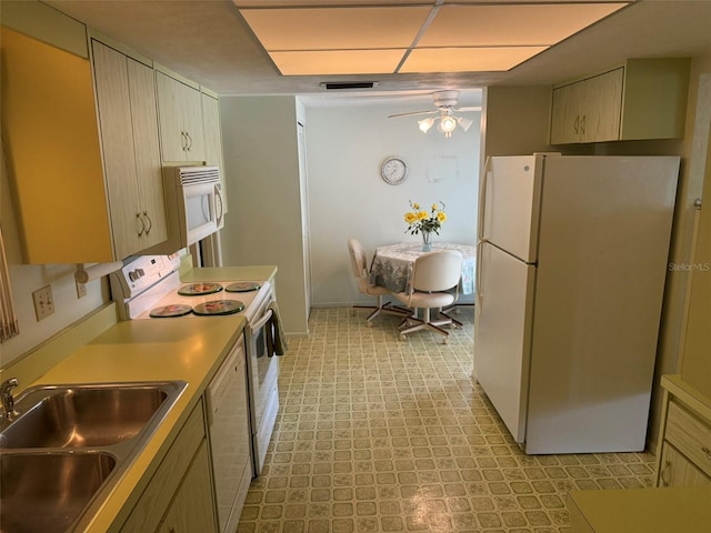 3673 Somerville Dr Unit 1510, Sarasota, FL 34232 - kitchen with white appliances, a sink, a ceiling fan, light floors, and light countertops