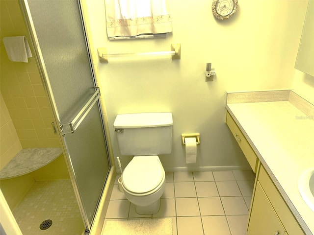 3673 Somerville Dr Unit 1510, Sarasota, FL 34232 - full bath with vanity, tile patterned flooring, a shower stall, and toilet