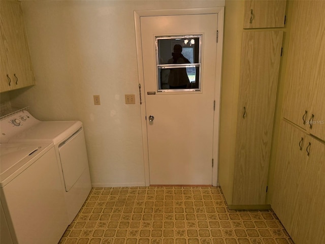 3673 Somerville Dr Unit 1510, Sarasota, FL 34232 - laundry area with cabinet space, separate washer and dryer, and light flooring