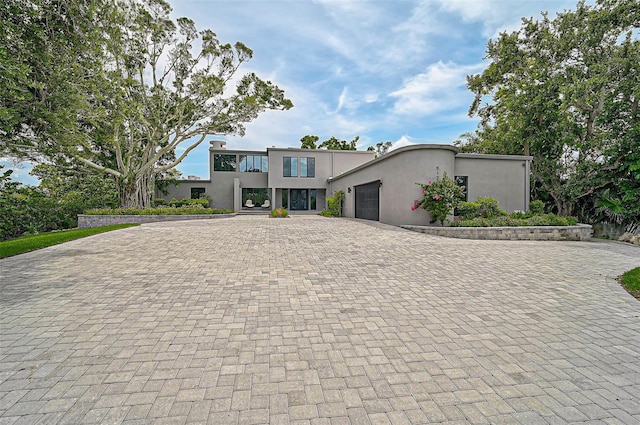 512 Treasure Boat Way, Sarasota, FL 34242 - contemporary home with decorative driveway, stucco siding, and a garage