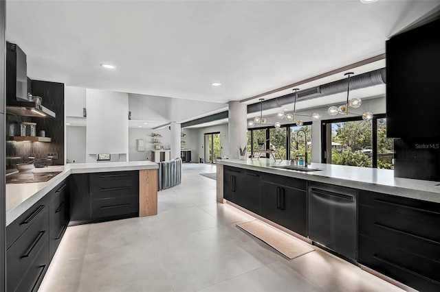512 Treasure Boat Way, Sarasota, FL 34242 - kitchen featuring dishwasher, light countertops, wall chimney exhaust hood, decorative light fixtures, and a peninsula