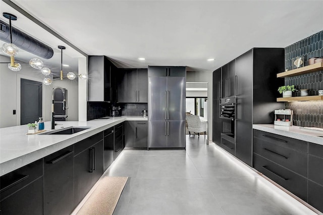 512 Treasure Boat Way, Sarasota, FL 34242 - kitchen with decorative backsplash, dark cabinets, light countertops, recessed lighting, and modern cabinets