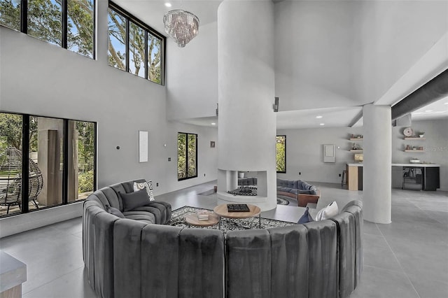 512 Treasure Boat Way, Sarasota, FL 34242 - living area with a high ceiling, light tile patterned floors, a chandelier, and recessed lighting