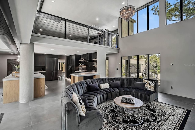 512 Treasure Boat Way, Sarasota, FL 34242 - living area featuring healthy amount of natural light, recessed lighting, a high ceiling, and a chandelier