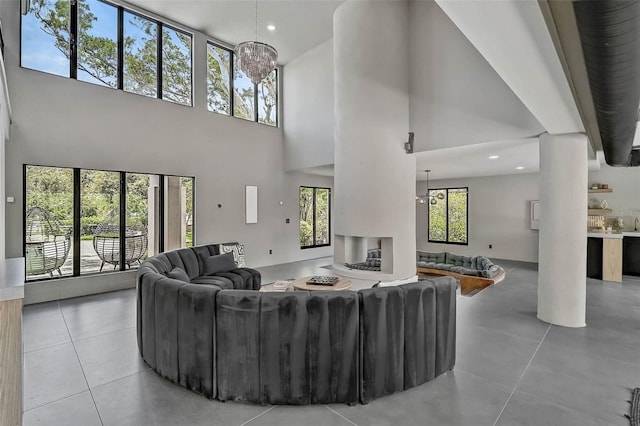 512 Treasure Boat Way, Sarasota, FL 34242 - living room featuring a high ceiling, tile patterned floors, and recessed lighting