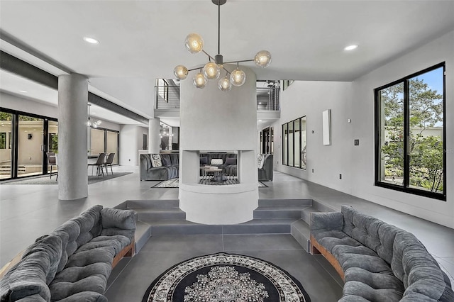 512 Treasure Boat Way, Sarasota, FL 34242 - sunken living room with plenty of natural light, a chandelier, and recessed lighting