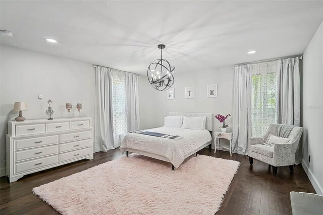 512 Treasure Boat Way, Sarasota, FL 34242 - bedroom with multiple windows, a chandelier, dark wood-type flooring, and recessed lighting
