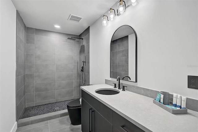 512 Treasure Boat Way, Sarasota, FL 34242 - full bathroom with a tile shower, vanity, and tile patterned flooring