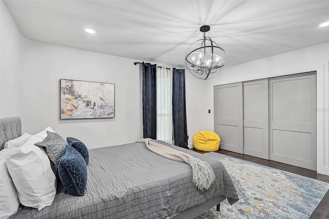 512 Treasure Boat Way, Sarasota, FL 34242 - bedroom with a chandelier, wood finished floors, recessed lighting, and a closet