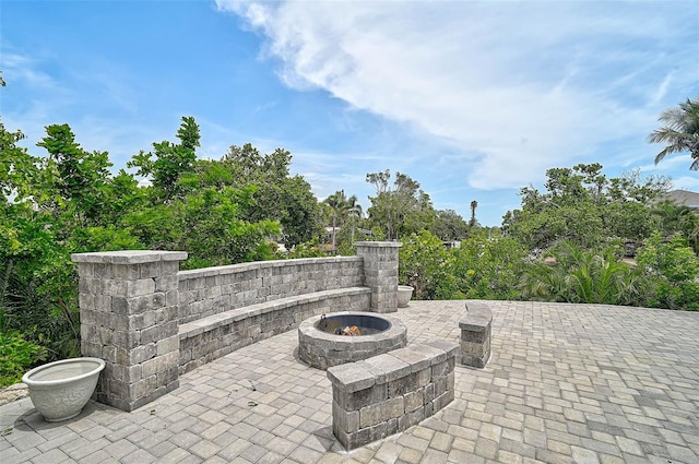 512 Treasure Boat Way, Sarasota, FL 34242 - view of patio featuring an outdoor fire pit