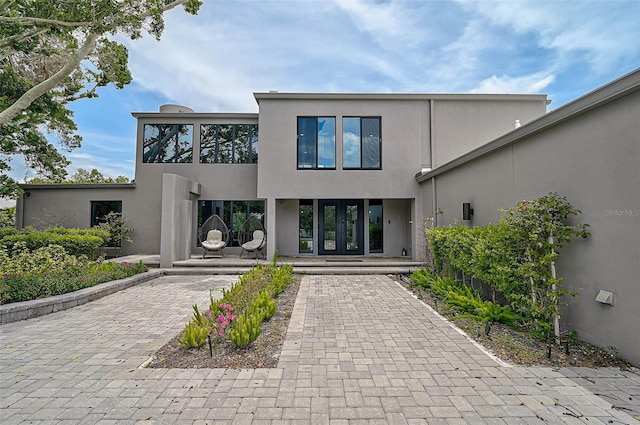 512 Treasure Boat Way, Sarasota, FL 34242 - back of property featuring stucco siding and french doors