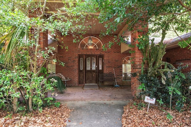 418 W Holly Dr, Orange City, FL 32763 - view of exterior entry featuring brick siding