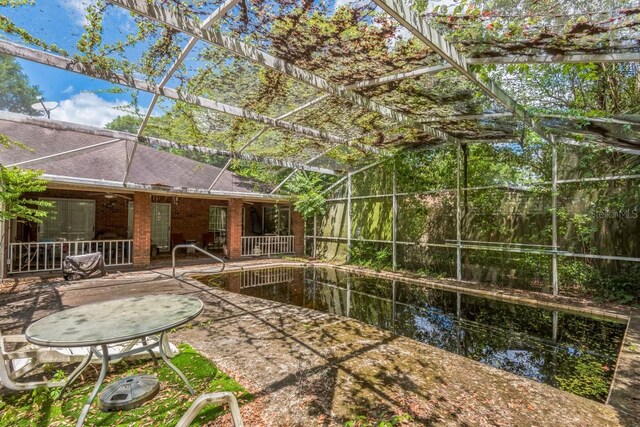 418 W Holly Dr, Orange City, FL 32763 - view of yard with a patio, an outdoor pool, and glass enclosure