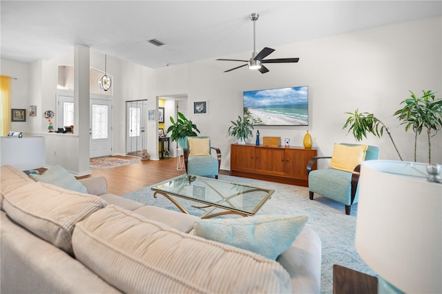 5110 19th Ave W, Bradenton, FL 34209 - living room featuring a ceiling fan, wood finished floors, and baseboards