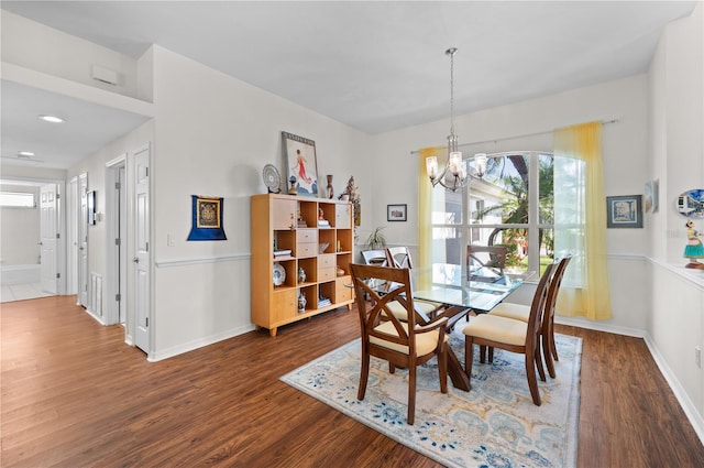 5110 19th Ave W, Bradenton, FL 34209 - dining room with a chandelier, wood finished floors, and baseboards