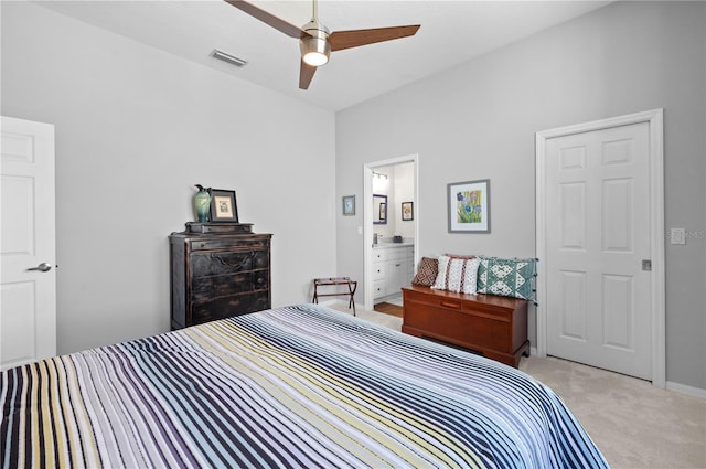 5110 19th Ave W, Bradenton, FL 34209 - bedroom with light carpet, ensuite bath, and a ceiling fan