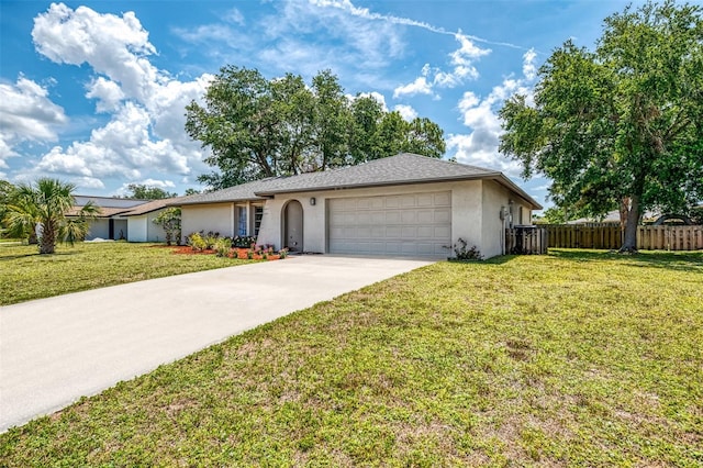 4155 Center Gate Blvd, Sarasota, FL 34233 - ranch-style house with stucco siding, an attached garage, and driveway