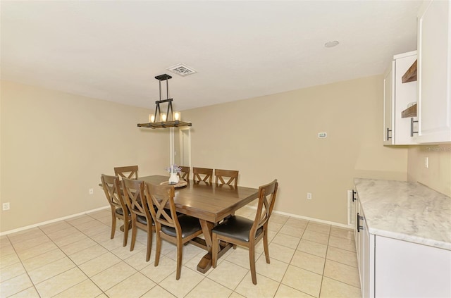 4155 Center Gate Blvd, Sarasota, FL 34233 - dining area featuring light tile patterned flooring, a chandelier, and baseboards