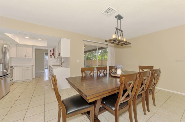 4155 Center Gate Blvd, Sarasota, FL 34233 - dining area featuring light tile patterned floors, a tray ceiling, baseboards, and recessed lighting