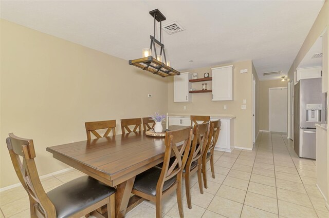 4155 Center Gate Blvd, Sarasota, FL 34233 - dining room with light tile patterned flooring and baseboards