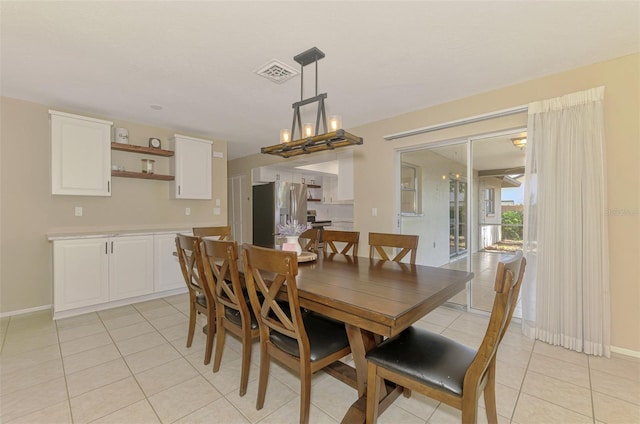 4155 Center Gate Blvd, Sarasota, FL 34233 - dining room featuring light tile patterned flooring and baseboards