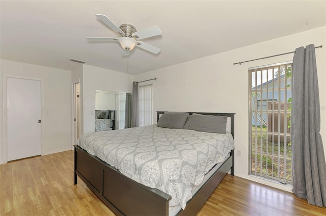 4155 Center Gate Blvd, Sarasota, FL 34233 - bedroom featuring light wood-type flooring, access to exterior, ceiling fan, and baseboards
