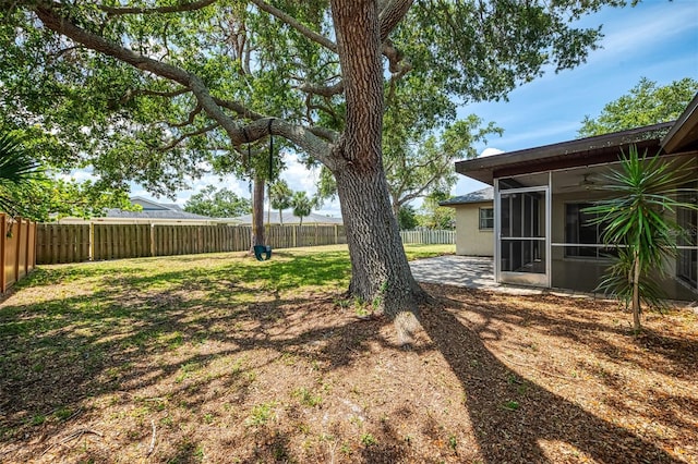 4155 Center Gate Blvd, Sarasota, FL 34233 - view of yard with a sunroom and a patio