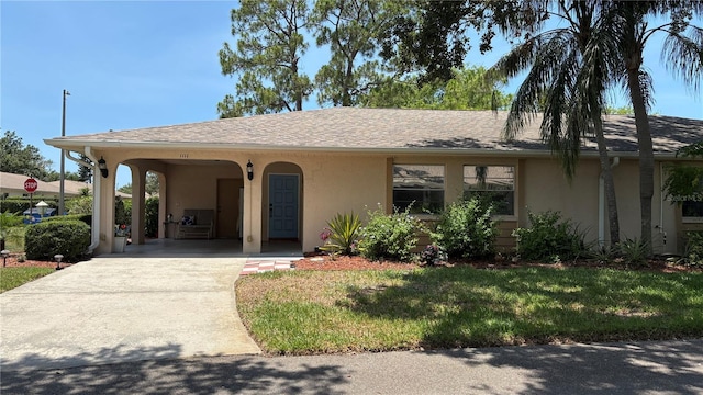 1111 Harefield Cir, Sun City Center, FL 33573 - ranch-style home with stucco siding, concrete driveway, a front yard, and an attached carport