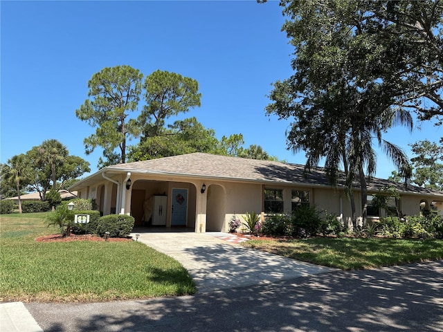 1111 Harefield Cir, Sun City Center, FL 33573 - single story home featuring concrete driveway, stucco siding, a front yard, and an attached carport