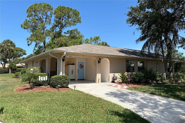 1111 Harefield Cir, Sun City Center, FL 33573 - single story home featuring stucco siding, driveway, a front yard, and a carport