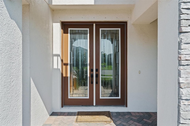 8932 Isabella Cir, Parrish, FL 34219 - entrance to property with french doors and stucco siding