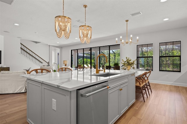 8932 Isabella Cir, Parrish, FL 34219 - kitchen featuring stainless steel dishwasher, a chandelier, open floor plan, a sink, and recessed lighting