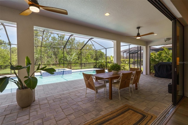 8932 Isabella Cir, Parrish, FL 34219 - sunroom / solarium featuring a ceiling fan, a pool, and a jacuzzi