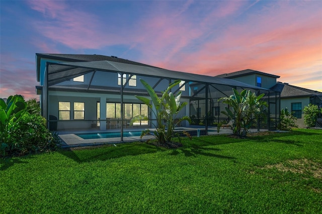 8932 Isabella Cir, Parrish, FL 34219 - rear view of house featuring an outdoor pool, a lawn, stucco siding, and a patio