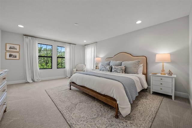 8932 Isabella Cir, Parrish, FL 34219 - bedroom with light colored carpet, recessed lighting, and baseboards