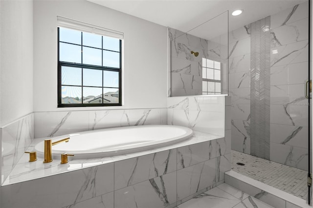 8932 Isabella Cir, Parrish, FL 34219 - full bath featuring plenty of natural light, a marble finish shower, a bath, and recessed lighting
