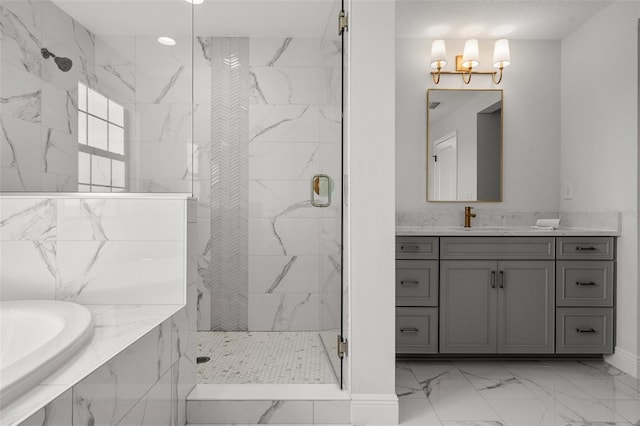 8932 Isabella Cir, Parrish, FL 34219 - bathroom featuring a marble finish shower, marble finish flooring, a garden tub, vanity, and baseboards