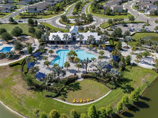 8932 Isabella Cir, Parrish, FL 34219 - aerial view of property's location featuring a pool area, nearby suburban area, and a large body of water