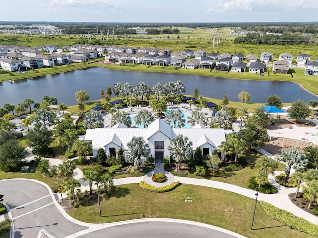 8932 Isabella Cir, Parrish, FL 34219 - aerial perspective of suburban area featuring a large body of water and a pool area